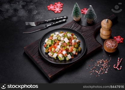 Greek salad of fresh cucumber, tomato, sweet pepper, lettuce, red onion, feta cheese and olives with olive oil. Greek salad with juicy tomatoes, feta cheese, lettuce, green olives, cucumber, red onion and fresh parsley