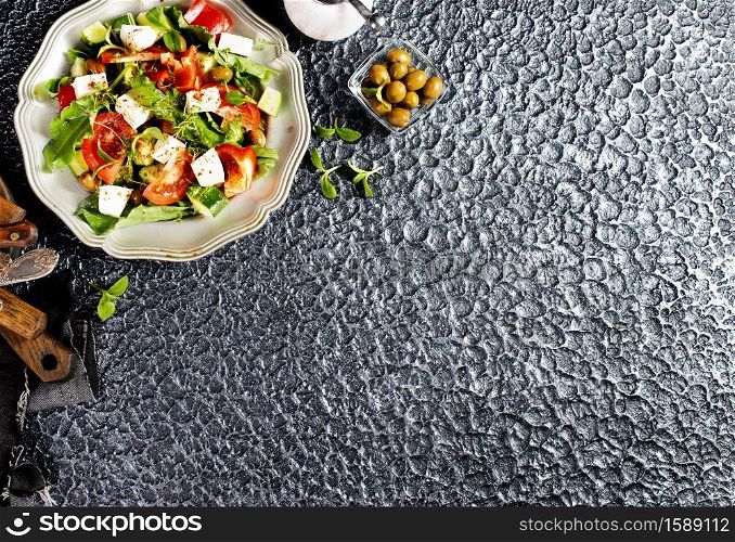 greek salad on metal plate, salad with feta cheese