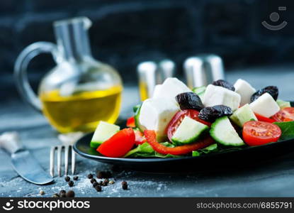 greek salad on plate and on a table