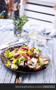 greek salad on plate on a table