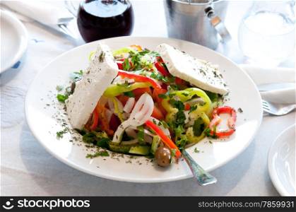 Greek salad on the big white dish