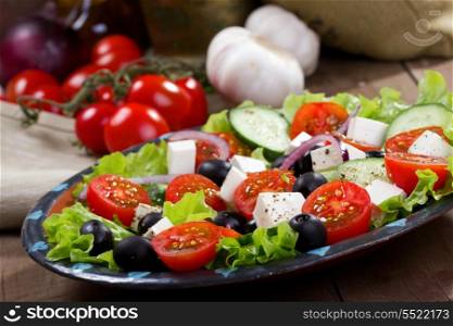 greek salad with fresh vegetables and feta cheese