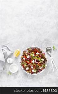 Greek salad with fresh vegetables, lettuce and feta cheese