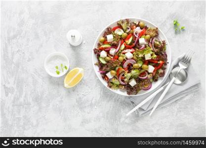 Greek salad with fresh vegetables, lettuce and feta cheese