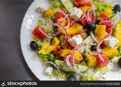 Greek salad with olives, feta cheese and vegetables