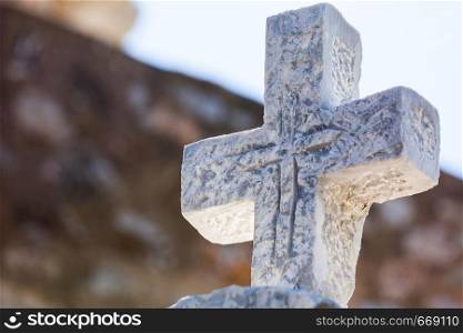 Greek stone cross on burial ground, architecture detail, Vathia Mani Greece. Greek stone cross on burial ground