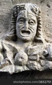 Greek stone mask on the stone in theater in Myra, Turkey