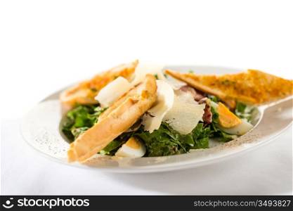 Greek style salad with garlic bread, egg, parmesan and bacon