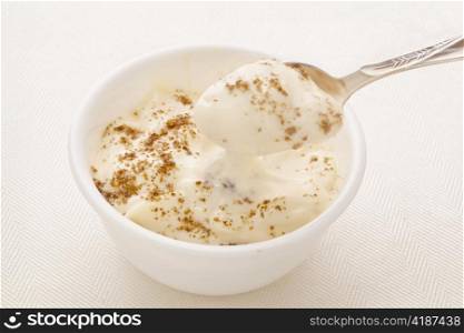Greek style yogurt sprinkled with ground chia seeds - healthy breakfast concept