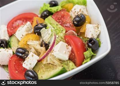Greek tasty salad. Greek salad (feta cheese, olive and vegetables)