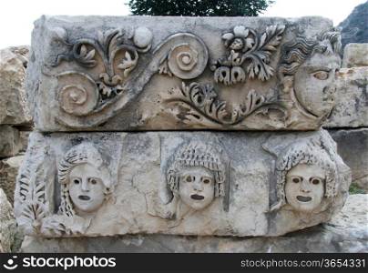 Greek theater masks on the stone in Myra, Turkey