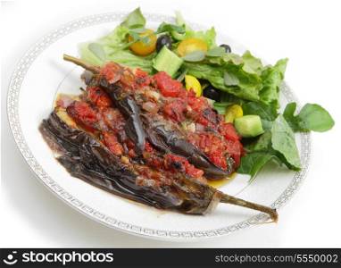 Greek traditional stuffed aubergines, known as imam melitzanes or imam baildi. The veg is stuffed with an onion, tomato, parsley, garlic mix and baked