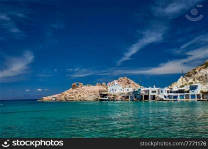 Greek village scenic picturesque view in Greece - the beach and fishing village of Firapotamos in Milos island, Greece. The beach of Firapotamos in Milos, Greece
