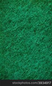 Green abrasive sponge texture background like grass