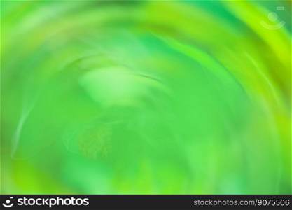 Green abstract multi colored light trail vortex. Fresh green lights moving in circular pattern.. Blurred motion green bokeh cycle of events in life concept