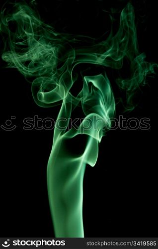 green abstract smoke on the black background