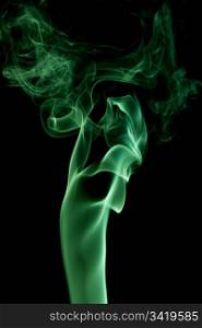 green abstract smoke on the black background