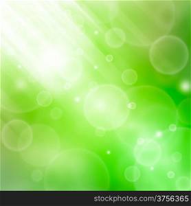 Green abstract spring background with bokeh and sunburst