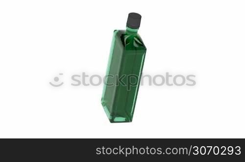 Green alcohol bottle spin on white background