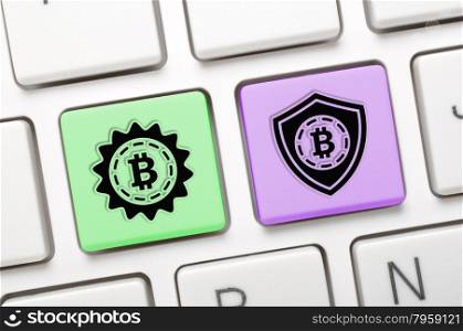 Green and purple bitcoin key on keyboard