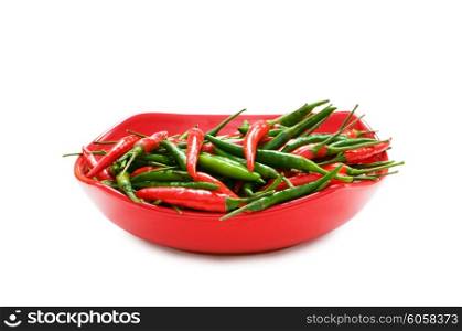 Green and red chili peppers isolated on white