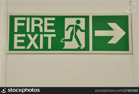 green and white fire exit sign (guidance to wayout)