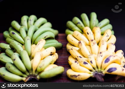 green and yellow bananas fruits in the market