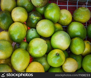 Green and yellow fresh passion fruits harvest from garden / Passiflora foetida