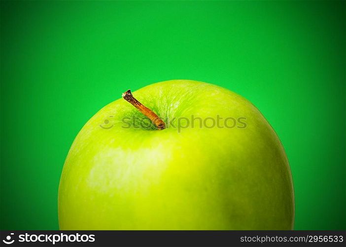 Green apple against green background