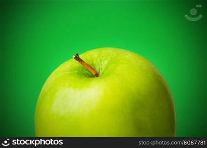 Green apple against green background