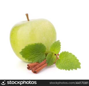 Green apple, cinnamon sticks and mint leaves still life isolated on white cutout.