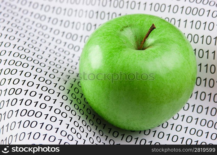 green apple on a binary code