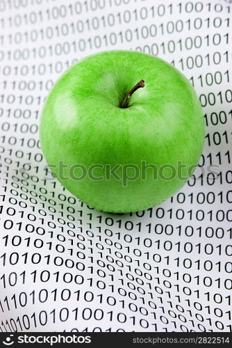 green apple on a binary code