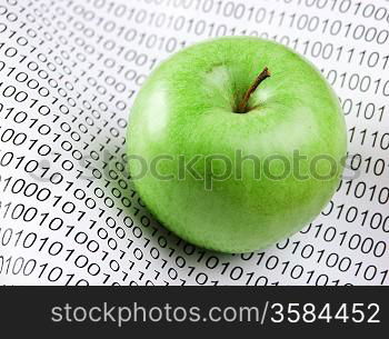 green apple on a binary code