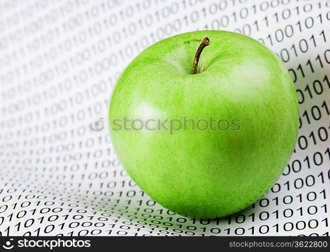 green apple on a binary code