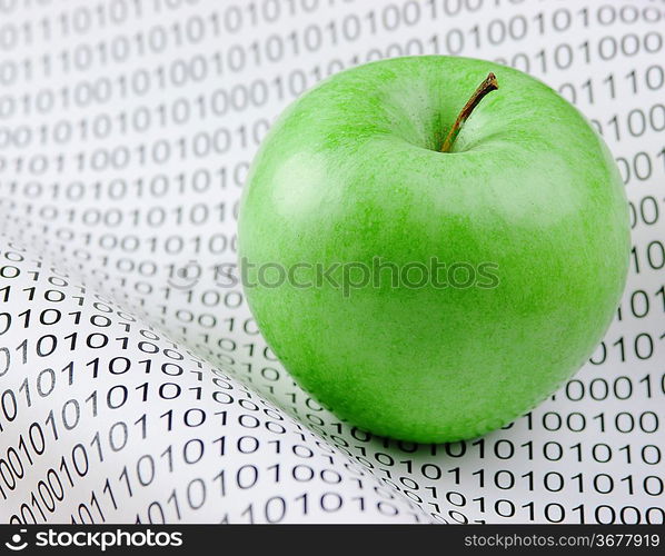 green apple on a binary code