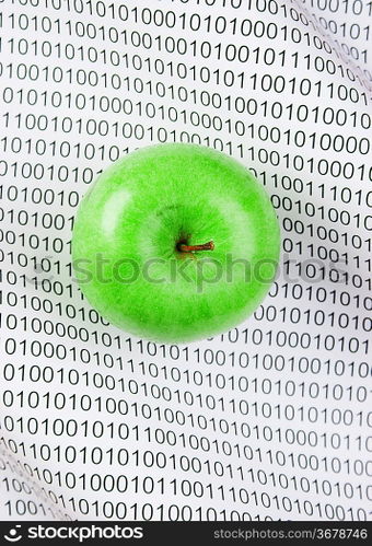 green apple on a binary code