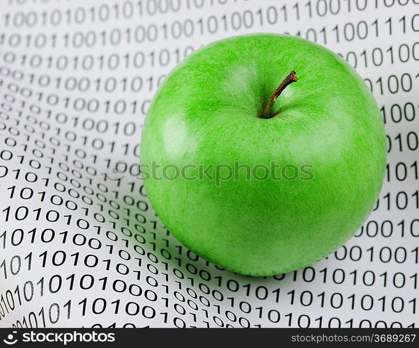 green apple on a binary code