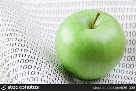 green apple on a binary code