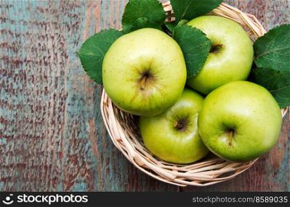 green apple on a wooden table.