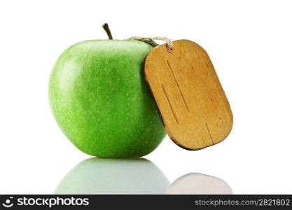 green apple with tag isolated on white background