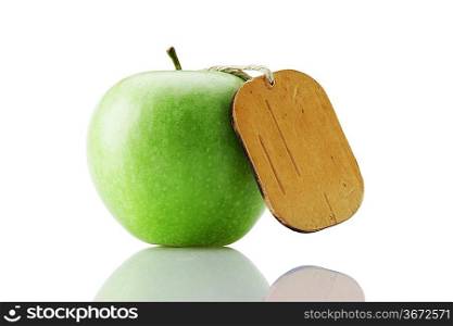 green apple with tag isolated on white background