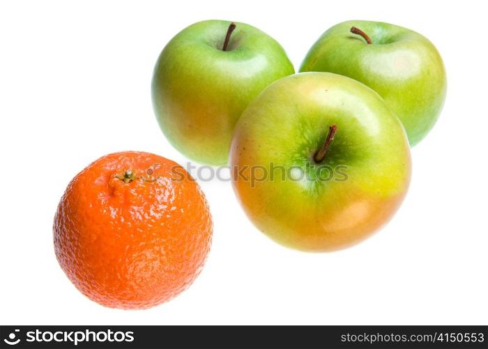 Green Apples and tangerine on white background