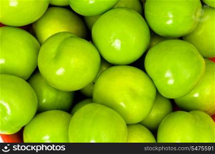 Green apples arranged on the market stand