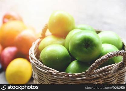 Green Apples / Harvest apple in the basket collect fruit in the garden