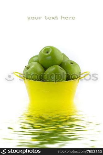 Green apples on a white background with soft focus reflected in the water. With sample text