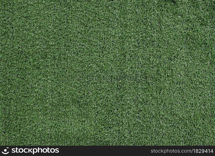 Green artificial grass texture background. Top view