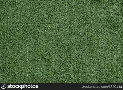 Green artificial grass texture background. Top view