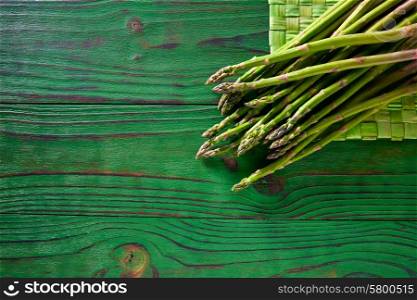 green asparagus fresh on wooden monochrome rustic table