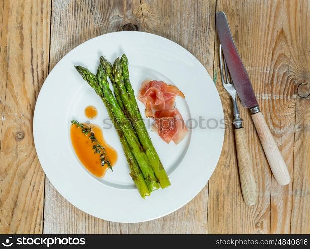 Green asparagus with ham and sauce. Green asparagus with ham and sauce.
